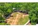 Expansive green space and stage nestled among trees; perfect for outdoor events and recreation at 118 Brighton Blvd, Woodstock, GA 30188