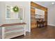 Bright hallway featuring hardwood floors, decorative mirror, and a unique accent wall at 118 Brighton Blvd, Woodstock, GA 30188