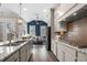 Spacious kitchen features a large island with modern appliances and wooden floors at 118 Brighton Blvd, Woodstock, GA 30188