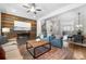 Spacious open-concept featuring a decorative wall, hardwood floors, fireplace, and an open-concept design at 118 Brighton Blvd, Woodstock, GA 30188