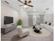 Bright living room features modern ceiling fan, neutral tones, and sliding barn doors at 118 Brighton Blvd, Woodstock, GA 30188