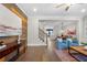 Spacious living room with hardwood floors, accent wall, open access to the dining room, and staircase at 118 Brighton Blvd, Woodstock, GA 30188
