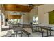 Large community pavilion featuring picnic tables, ceiling fans, and views of the surrounding neighborhood at 118 Brighton Blvd, Woodstock, GA 30188