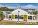Outdoor pavilion with green barn doors and colorful Adirondack chairs; perfect for gatherings at 118 Brighton Blvd, Woodstock, GA 30188