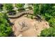 Playground featuring wood bridges, a climbing net and playground equipment; a fun outdoor space at 118 Brighton Blvd, Woodstock, GA 30188