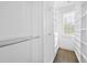 Walk-in Closet is spacious with custom shelves and natural lighting at 118 Brighton Blvd, Woodstock, GA 30188