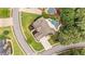 Stunning aerial view of a home featuring a uniquely designed pool, meticulously manicured landscaping, and a lush green lawn at 134 Lakestone Pkwy, Woodstock, GA 30188