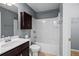 Functional bathroom featuring a vanity, tub, and enclosed toilet area at 134 Lakestone Pkwy, Woodstock, GA 30188