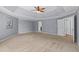 Expansive main bedroom with a tray ceiling leading to ensuite bathroom at 134 Lakestone Pkwy, Woodstock, GA 30188