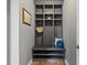 Mudroom featuring custom built-in shelving, seating, and storage at 134 Lakestone Pkwy, Woodstock, GA 30188