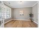 Bright and airy office space with hardwood floors, plantation shutters, and a tranquil view, perfect for working from home at 134 Lakestone Pkwy, Woodstock, GA 30188