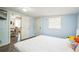 Spacious bedroom with a window, offering a cozy spot for relaxation and restful sleep at 3251 Auburn Ave, Dacula, GA 30019