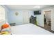 Charming bedroom with blue walls, a TV, an updated closet, and comfortable furniture, perfect for relaxation and entertainment at 3251 Auburn Ave, Dacula, GA 30019