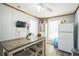 Bright kitchen featuring a dining table, white appliances, and ample natural light from the window at 3251 Auburn Ave, Dacula, GA 30019