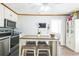 Cozy kitchen with stainless steel appliances, a center island, and ample storage space at 3251 Auburn Ave, Dacula, GA 30019
