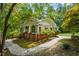 Charming front porch with brick base and ceiling fan offering a great space to enjoy the outdoors at 4728 Corn Creek Drive, Fairburn, GA 30213