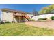 Spacious backyard with a deck, retaining wall, and lush green grass at 15 Cobblestone Ct, Douglasville, GA 30134