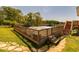 Landscaped backyard with wooden deck and fenced pool area at 15 Cobblestone Ct, Douglasville, GA 30134