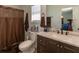 Bathroom features a shower with a curtain and vanity with ample counter space and cabinets at 15 Cobblestone Ct, Douglasville, GA 30134