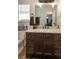 Bathroom featuring a shower with a curtain and vanity with ample counter space and cabinets at 15 Cobblestone Ct, Douglasville, GA 30134