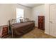 Bedroom with metal frame daybed, dark wood dresser, and neutral-colored carpet at 15 Cobblestone Ct, Douglasville, GA 30134