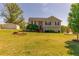 Charming home with a manicured lawn and a detached garage on a sunny day at 15 Cobblestone Ct, Douglasville, GA 30134