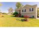 Well-maintained home featuring a spacious front yard and garden at 15 Cobblestone Ct, Douglasville, GA 30134