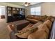 Cozy living room with comfortable seating, a large TV, and natural light at 15 Cobblestone Ct, Douglasville, GA 30134