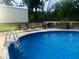 Backyard pool with deck and seating area at 15 Cobblestone Ct, Douglasville, GA 30134