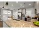 Spacious kitchen featuring granite countertops, stainless steel appliances, and open layout at 1744 Habershal Nw Rd, Atlanta, GA 30318