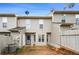 Exterior view of the rear of the property featuring a fenced in backyard with patio at 4413 Pinscher St, Union City, GA 30291