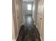 Hallway with wood-look flooring and white doors at 4413 Pinscher St, Union City, GA 30291