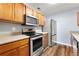 Well-lit kitchen with stainless steel appliances, plenty of cabinet space, and modern finishes at 4413 Pinscher St, Union City, GA 30291