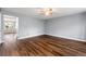 Spacious living room with beautiful wood flooring and neutral paint, perfect for relaxation and entertaining at 4413 Pinscher St, Union City, GA 30291