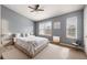 A main bedroom with carpet, multiple windows, and neutral decor at 4413 Pinscher St, Union City, GA 30291