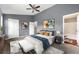 Spacious main bedroom features art, ceiling fan, and an ensuite bathroom at 4413 Pinscher St, Union City, GA 30291