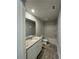 Bathroom with a vanity, granite countertop, toilet and tub at 111 Deer Xing, Temple, GA 30179