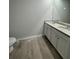 Bathroom featuring a double vanity with granite countertops and modern fixtures at 111 Deer Xing, Temple, GA 30179