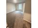 Cozy bedroom with a window and plush carpeting, creating a warm and inviting atmosphere at 111 Deer Xing, Temple, GA 30179