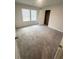 Well-lit bedroom with large windows and a closet, providing a comfortable living space at 111 Deer Xing, Temple, GA 30179