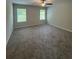 Spacious carpeted bedroom with a ceiling fan and windows offering natural light at 111 Deer Xing, Temple, GA 30179