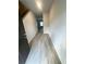 Bright hallway with durable wood flooring, a neutral color palette, and access to multiple rooms at 111 Deer Xing, Temple, GA 30179