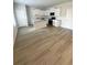Open-concept kitchen with white cabinets, stainless steel appliances, and a functional island at 111 Deer Xing, Temple, GA 30179