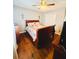 Cozy bedroom featuring hardwood floors and a ceiling fan at 3420 Caley Mill Ln, Powder Springs, GA 30127