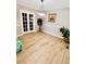 Dining area with laminated wood flooring and doors to other rooms at 3420 Caley Mill Ln, Powder Springs, GA 30127
