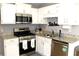 Well-lit kitchen with stainless steel appliances and granite countertops at 3420 Caley Mill Ln, Powder Springs, GA 30127