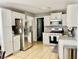 Spacious kitchen with stainless steel refrigerator and granite countertops at 3420 Caley Mill Ln, Powder Springs, GA 30127