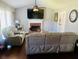 Cozy living room featuring a brick fireplace and comfortable seating at 3420 Caley Mill Ln, Powder Springs, GA 30127