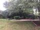 Scenic backyard featuring a gazebo with outdoor seating and mature trees at 3546 Mount Vernon Ct, Lawrenceville, GA 30044