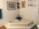 A soaking tub is surrounded by a marble platform and decor at 3546 Mount Vernon Ct, Lawrenceville, GA 30044